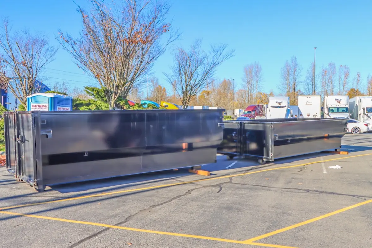 Professional dumpster rental service with roll-off container on residential driveway in Galt